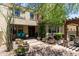 Landscaped backyard with pergola and comfortable seating for easy living and entertaining at 3554 N Hooper St, Buckeye, AZ 85396