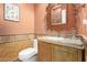 Charming bathroom featuring stylish vanity with granite countertop and ornate mirror at 3554 N Hooper St, Buckeye, AZ 85396