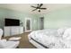 A bright bedroom boasts a ceiling fan and sliding glass doors at 3554 N Hooper St, Buckeye, AZ 85396