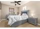 Bedroom featuring bed, nightstand, and dresser at 3554 N Hooper St, Buckeye, AZ 85396