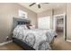 Comfortable bedroom featuring a ceiling fan, closet, carpet, and neutral-tone paint at 3554 N Hooper St, Buckeye, AZ 85396