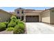 This home boasts a two-car garage, appealing landscaping, and a tidy driveway for easy access at 3554 N Hooper St, Buckeye, AZ 85396