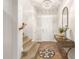 Bright foyer with tile flooring, chandelier, elegant console table, and stairs leading to the upper level at 3554 N Hooper St, Buckeye, AZ 85396