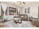 Bright living room showcasing shuttered windows, comfortable seating, and stylish decor at 3554 N Hooper St, Buckeye, AZ 85396