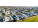Beautiful aerial view of neighborhood with many houses and a lush green field at 3684 E Boot Track Trl, Gilbert, AZ 85296