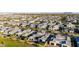 Expansive aerial view of a residential neighborhood featuring neatly lined homes and picturesque mountain views at 3684 E Boot Track Trl, Gilbert, AZ 85296