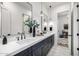 Bathroom with double vanity, marble counters, modern fixtures, and decor at 3684 E Boot Track Trl, Gilbert, AZ 85296