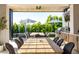 Spacious outdoor dining area featuring a BBQ, TV, and relaxing backyard view at 3684 E Boot Track Trl, Gilbert, AZ 85296