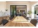Elegant outdoor dining area with a view of the home's interior, perfect for entertaining at 3684 E Boot Track Trl, Gilbert, AZ 85296