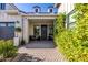 Charming entryway with a decorative wreath, comfortable seating, and verdant landscaping at 3684 E Boot Track Trl, Gilbert, AZ 85296