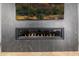 Modern fireplace with a sleek design, set against a marble wall at 3684 E Boot Track Trl, Gilbert, AZ 85296