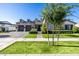 Well-maintained front exterior showcases lush lawn, neat landscaping, and a welcoming entrance on a sunny day at 3684 E Boot Track Trl, Gilbert, AZ 85296