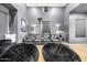 Home theater boasts tiered seating, projector, and plush beanbag chairs at 3684 E Boot Track Trl, Gilbert, AZ 85296