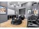 Home theater boasts tiered seating, large screen, and comfortable beanbag chairs at 3684 E Boot Track Trl, Gilbert, AZ 85296