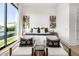 Bright main bedroom showcasing modern decor, sitting area, with natural light and views of the outdoors at 3684 E Boot Track Trl, Gilbert, AZ 85296