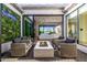 Stylish outdoor patio with a cozy fire pit, comfortable seating, and lush greenery creating a serene ambiance at 3684 E Boot Track Trl, Gilbert, AZ 85296