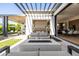Inviting outdoor patio with modern seating, sleek fire pit, and seamless indoor-outdoor flow at 3684 E Boot Track Trl, Gilbert, AZ 85296