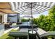 Beautiful backyard featuring a pool, lounge chairs, and outdoor dining area, perfect for entertaining at 3684 E Boot Track Trl, Gilbert, AZ 85296