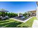 Beautiful pool and spa area featuring multiple fountains and lush surroundings at 3684 E Boot Track Trl, Gilbert, AZ 85296