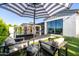Chic outdoor lounge area adjacent to a modern pool and stunning patio area at 3684 E Boot Track Trl, Gilbert, AZ 85296