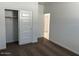 Clean bedroom with a closet, light switches, and fresh carpeting at 38055 W Excussare Way, Maricopa, AZ 85138
