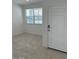 Bright entryway boasting natural light and tile flooring, adjacent to a window at 38055 W Excussare Way, Maricopa, AZ 85138