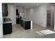 Open concept kitchen with a center island, stainless appliances, and ample counter space at 38055 W Excussare Way, Maricopa, AZ 85138