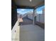 Covered patio with concrete flooring and a view of the block wall at 38055 W Excussare Way, Maricopa, AZ 85138