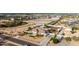 Expansive aerial view of a single-story home with large backyard and desert landscaping, next to new construction at 3911 N 197Th Ave, Buckeye, AZ 85396