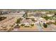 Aerial view of the single-story home with a large backyard, desert landscaping, and proximity to local amenities at 3911 N 197Th Ave, Buckeye, AZ 85396