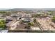 Expansive property aerial showcasing home's backyard, outdoor recreation, and solar panels at 3911 N 197Th Ave, Buckeye, AZ 85396