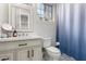 Charming bathroom featuring a white vanity with classic fixtures and decorative floor tiles at 3911 N 197Th Ave, Buckeye, AZ 85396