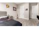 Comfortable bedroom with wood-look tile flooring and neutral paint at 3911 N 197Th Ave, Buckeye, AZ 85396