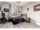 Nicely decorated bedroom with wood-look floors and a large window providing natural light at 3911 N 197Th Ave, Buckeye, AZ 85396