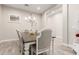 Cozy dining area with a chandelier and seating for four people, perfect for intimate meals at 3911 N 197Th Ave, Buckeye, AZ 85396