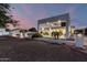 An exterior view of the backyard showcases a custom outdoor bar and covered patio at 3911 N 197Th Ave, Buckeye, AZ 85396