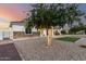Charming single-story home featuring a decorative stone facade, and gravel landscaping at 3911 N 197Th Ave, Buckeye, AZ 85396