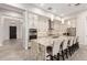 Gourmet kitchen with a large island, stainless steel appliances, and custom cabinetry at 3911 N 197Th Ave, Buckeye, AZ 85396