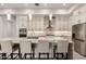 Beautiful kitchen with granite countertops, stainless steel appliances, and pendant lighting at 3911 N 197Th Ave, Buckeye, AZ 85396
