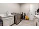 Laundry room featuring modern appliances, sink, and storage at 3911 N 197Th Ave, Buckeye, AZ 85396