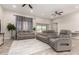 Spacious living room with modern furniture, ceiling fans, and ample natural light at 3911 N 197Th Ave, Buckeye, AZ 85396