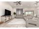 Comfortable living room with plush seating, a large TV, and a neutral color scheme at 3911 N 197Th Ave, Buckeye, AZ 85396
