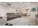 Open living space with modern furniture and clear sightlines into the gourmet kitchen at 3911 N 197Th Ave, Buckeye, AZ 85396