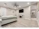 Spacious main bedroom featuring wood floors, fireplace, ceiling fan, and an ensuite bathroom at 3911 N 197Th Ave, Buckeye, AZ 85396