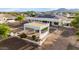 Aerial view of the outdoor living area, showcasing the patio, seating and landscaping at 3911 N 197Th Ave, Buckeye, AZ 85396
