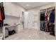 Walk-in closet with custom shelving, storage, and a desk area at 3911 N 197Th Ave, Buckeye, AZ 85396