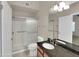 This bathroom offers a walk-in shower, granite counters, and ample vanity storage at 3932 E Tierra Buena E Ln, Phoenix, AZ 85032