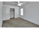 Bedroom with white walls, closet, and natural light at 3932 E Tierra Buena E Ln, Phoenix, AZ 85032