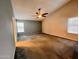 Expansive bedroom with neutral colors, carpet, and ceiling fan, offering ample space at 3932 E Tierra Buena E Ln, Phoenix, AZ 85032