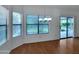 Bright dining area featuring large windows with backyard views and stylish chandelier lighting at 3932 E Tierra Buena E Ln, Phoenix, AZ 85032
